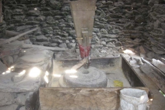 Traditional Grinding Stone operated by running water, grinding food grains to make flour. The Nepali name is Ghatta.
